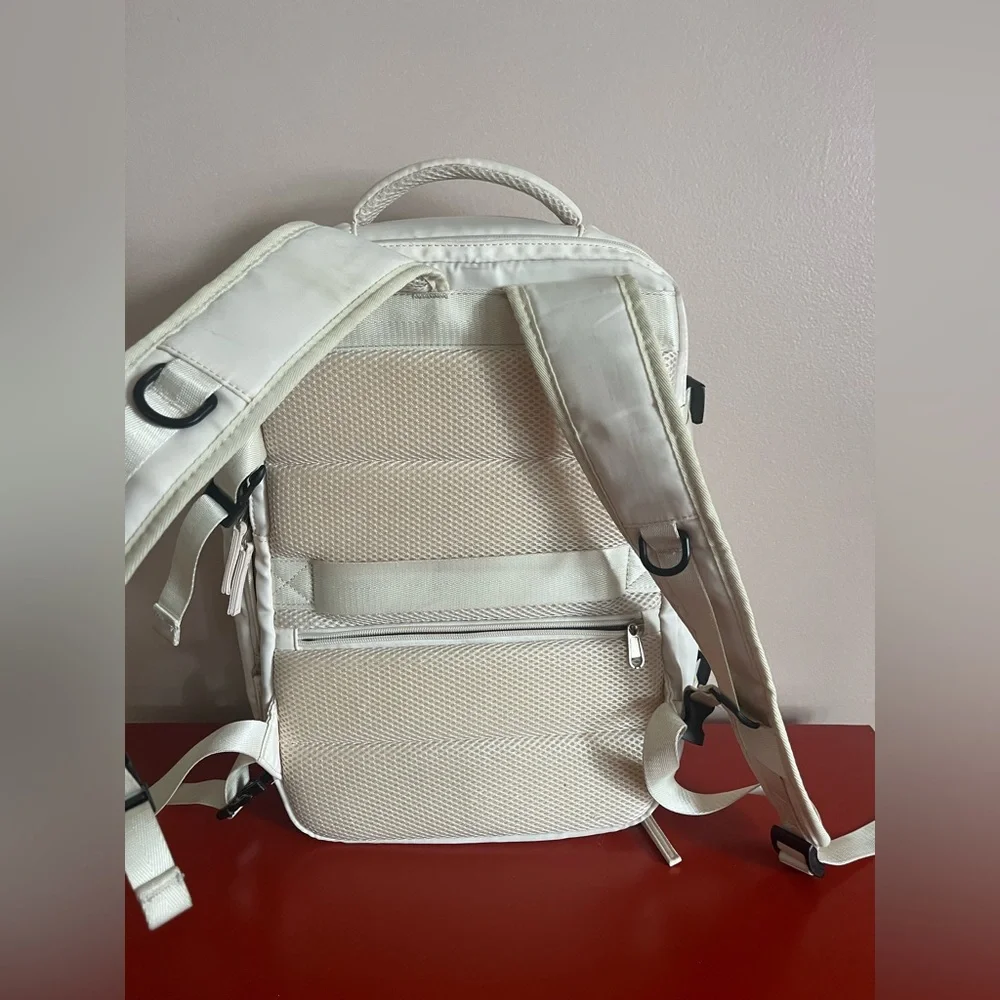 Elegant offwhite Travel carry on Backpack.So many compartments, zippers allwork🌸